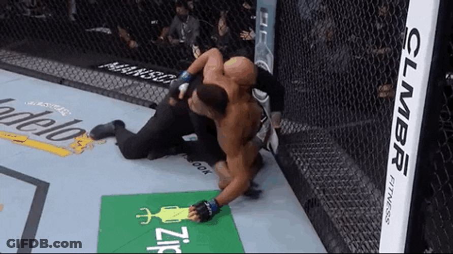 Holding Back Wrestler GIF