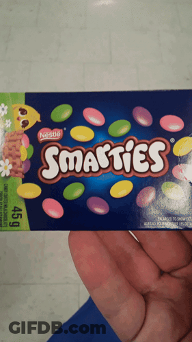 Holding Box Of Smarties GIF