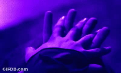 Holding Hands In Dark Room With Purple Light GIF