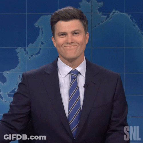 Holding In Laugh Colin Jost As Newscaster GIF
