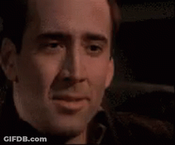 Holding In Laugh Nicolas Cage GIF