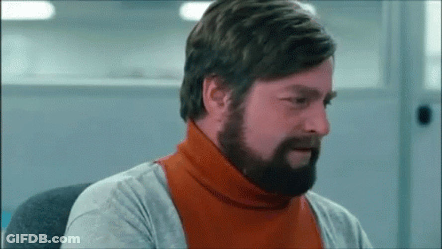 Holding In Laugh Zach Galifianakis GIF
