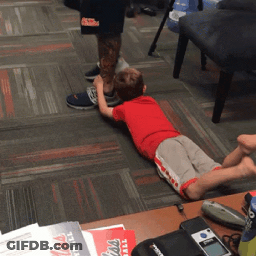 Holding On Leg Against The Wall GIF