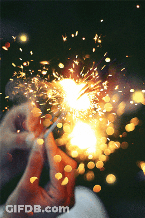 Holding Yellow Sparklers GIF
