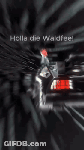 Holla Die Waldfee Is Written On A Screen With A Car In The Background GIF