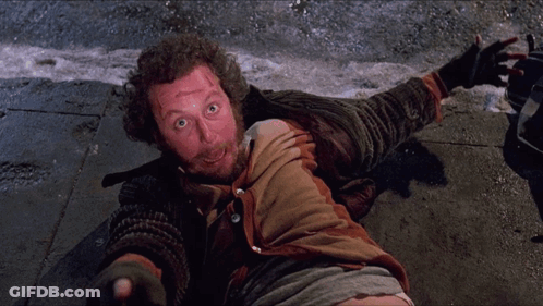 Homeless Man Lying On Sidewalk GIF