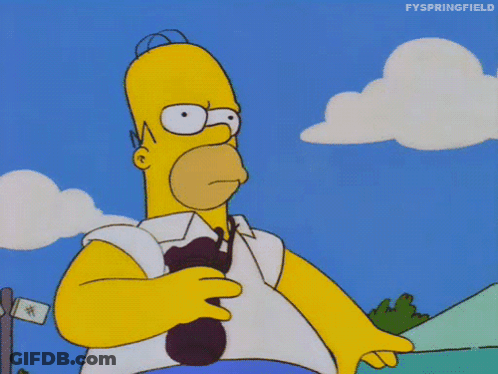 Homer Simpson From The Simpsons Is Holding A Spoon In His Right Hand GIF