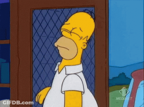 Homer Simpson From The Simpsons Is Standing In Front Of A Fence With His Eyes Closed .. GIF