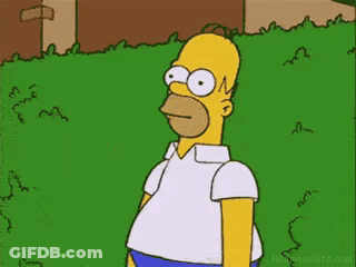 Homer Simpson Standing In Front Of Grassy Field GIF