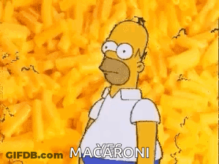 Homer Simpson From The Simpsons Is Standing In Front Of A Pile Of Macaroni . GIF