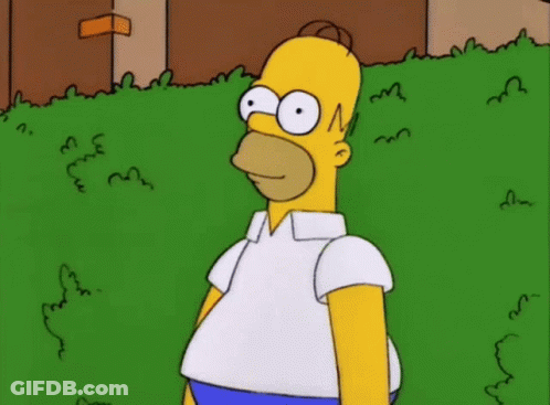 Homer Simpson From The Simpsons Is Standing In The Grass GIF