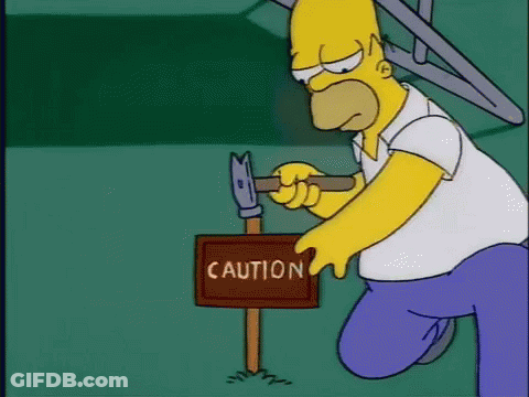 Homer Simpson Holding Hammer Next To Caution Sign GIF