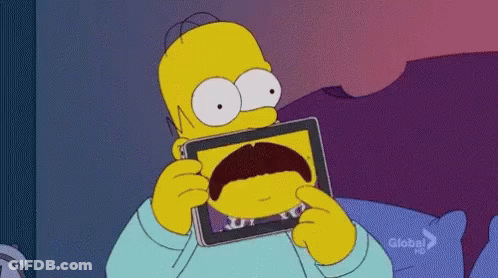 Homer Simpson Holding Tablet With Mustache Picture GIF