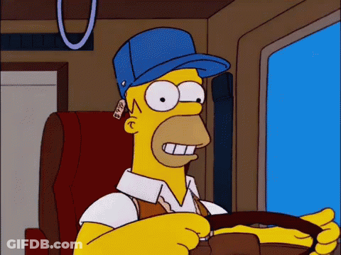 Homer Simpson In Blue Hat Holding Steering Wheel GIF