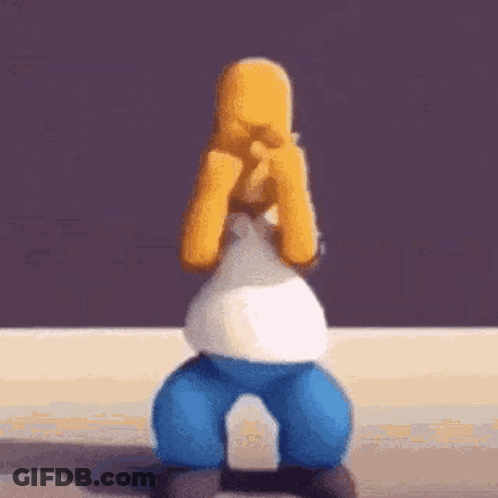 Homer Simpson Is Covering His Eyes With His Hands While Sitting On A Chair . GIF