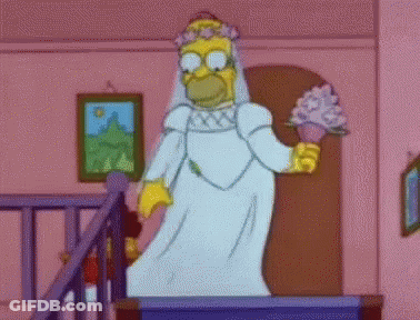 Homer Simpson Is Dressed As A Bride And Is Holding A Bouquet Of Flowers . GIF