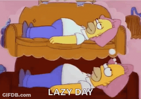 Homer Simpson Is Laying On A Couch With A Pink Pillow On His Head . GIF