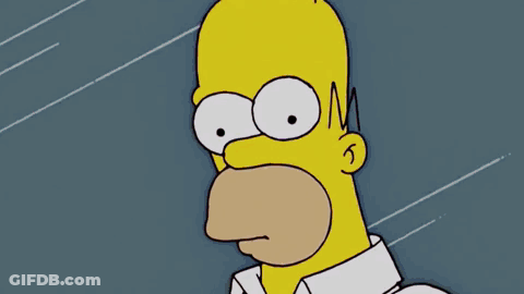 Homer Simpson Is Pointing At A Machine That Has The Word Product On It GIF