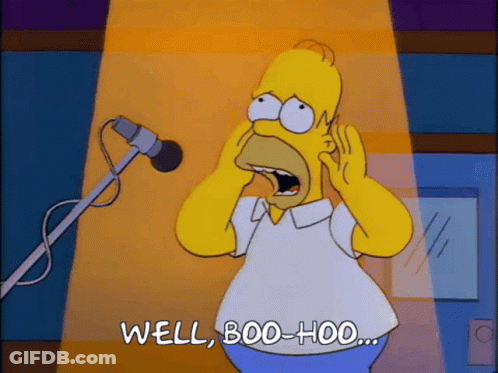 Homer Simpson Is Screaming Into A Microphone And Says Well Boo Hoo GIF