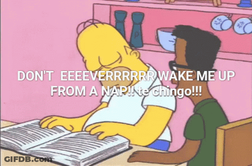 Homer Simpson Is Sitting At A Table Reading A Book While Another Man Looks On GIF