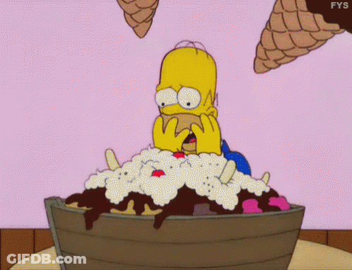 Homer Simpson Is Sitting In A Bucket Of Ice Cream With Ice Cream Cones Flying Around Him . GIF