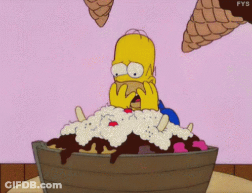 Homer Simpson Is Sitting In A Bucket Of Ice Cream With Ice Cream Cones Flying Around Him . GIF