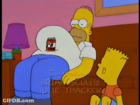 Homer Simpson Is Sitting On A Couch With Bart Standing Next To Him GIF