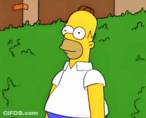 Homer Simpson Is Standing In A Grassy Field GIF