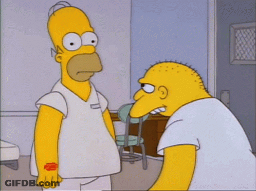 Homer Simpson Is Standing Next To A Bald Man In A White Shirt GIF