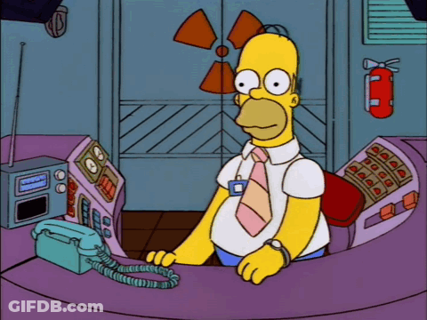 Homer Simpson Talking On Phone Near Fire Extinguisher GIF