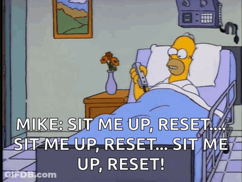 Homer Simpson Laying In Hospital Bed Holding Cell Phone GIF