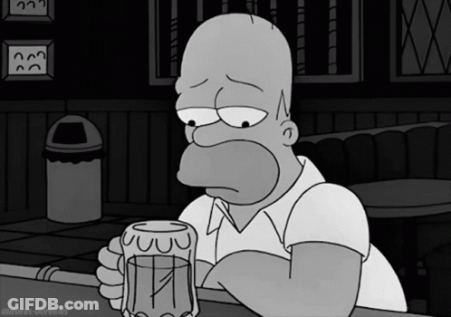 Homer Simpson Sitting At Bar Holding Beer GIF