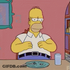 Homer Simpson Sitting At Table GIF