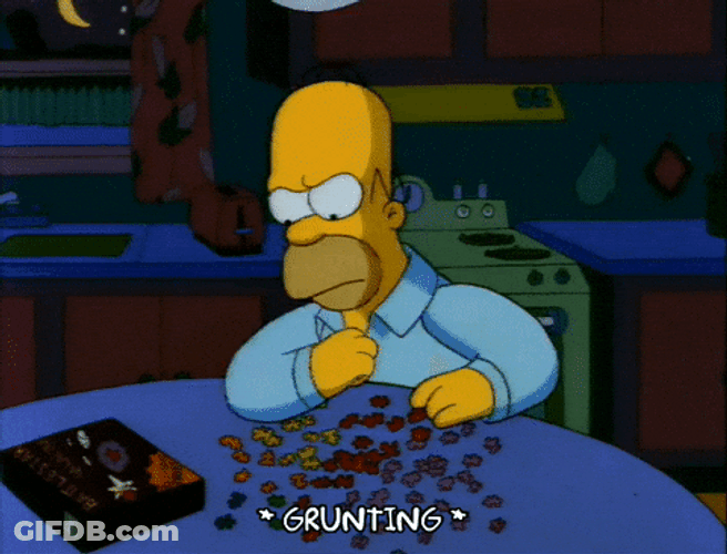 Homer Simpson Smashing Puzzle Pieces GIF
