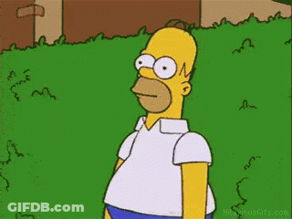 Homer Simpson Standing In Grassy Field GIF