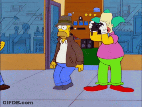 Homer Simpson Taking Photo Of Clown GIF