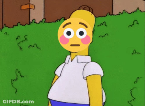 Homer Simpson With A Smiley Face On His Face Standing In The Grass GIF