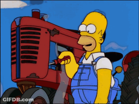 Homer Simpson Working On Red Tractor With Screwdriver GIF