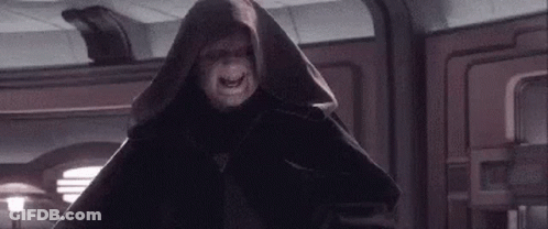 Hooded Man Standing In Room GIF