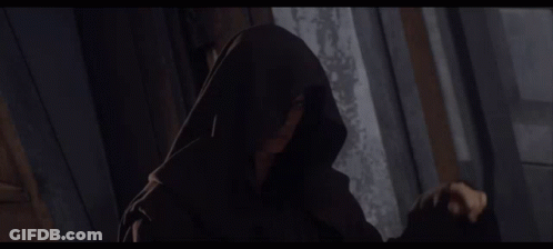 Hooded Person Standing In Darkness GIF