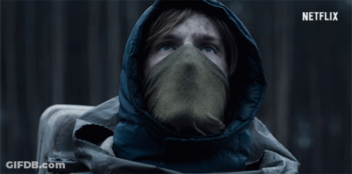Hooded Person With Scarf And Netflix Logo GIF