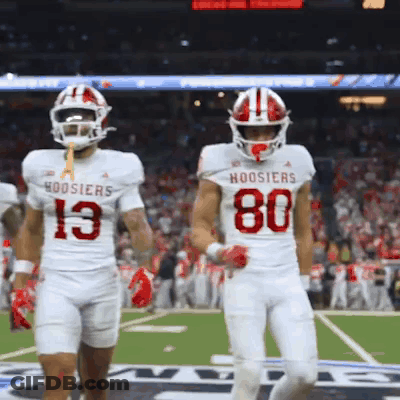 Hoosier Football Players 13 And 80 Walking On Field GIF