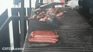 Hot Dogs Cooking On Grill GIF