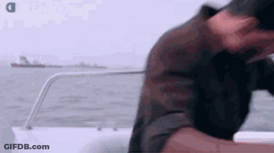 Hot Guy Holding A Gun GIF