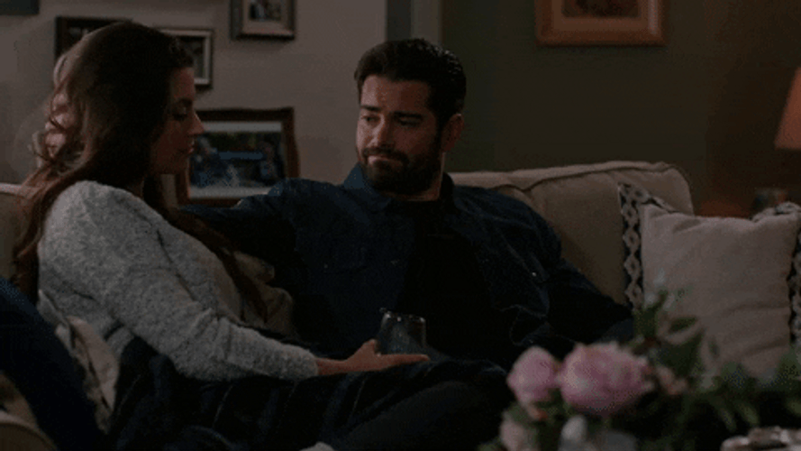 Hug Romantic Couple On The Couch GIF
