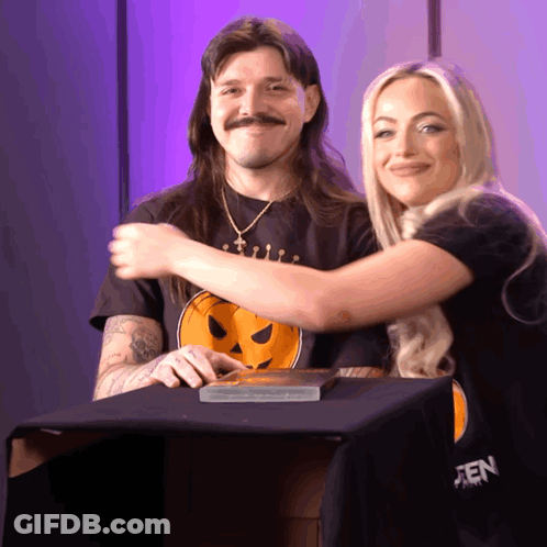 Hugging Couple Woman In Black Pumpkin Shirt GIF