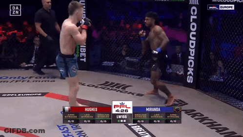 Hughes Fighting Miranda In A Cage GIF