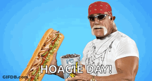 Hulk Hogan Is Holding A Sub Sandwich And A Cup Of Soda With Hoagie Day Written On The Bottom GIF