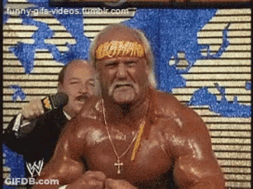 Hulk Hogan Is Wearing A Headband And Necklace With A Cross On It GIF