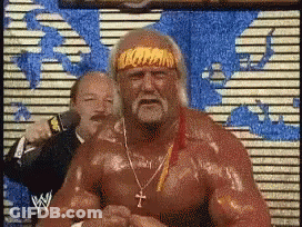 Hulk Hogan Is Wearing A Headband And Necklace With A Cross On It GIF